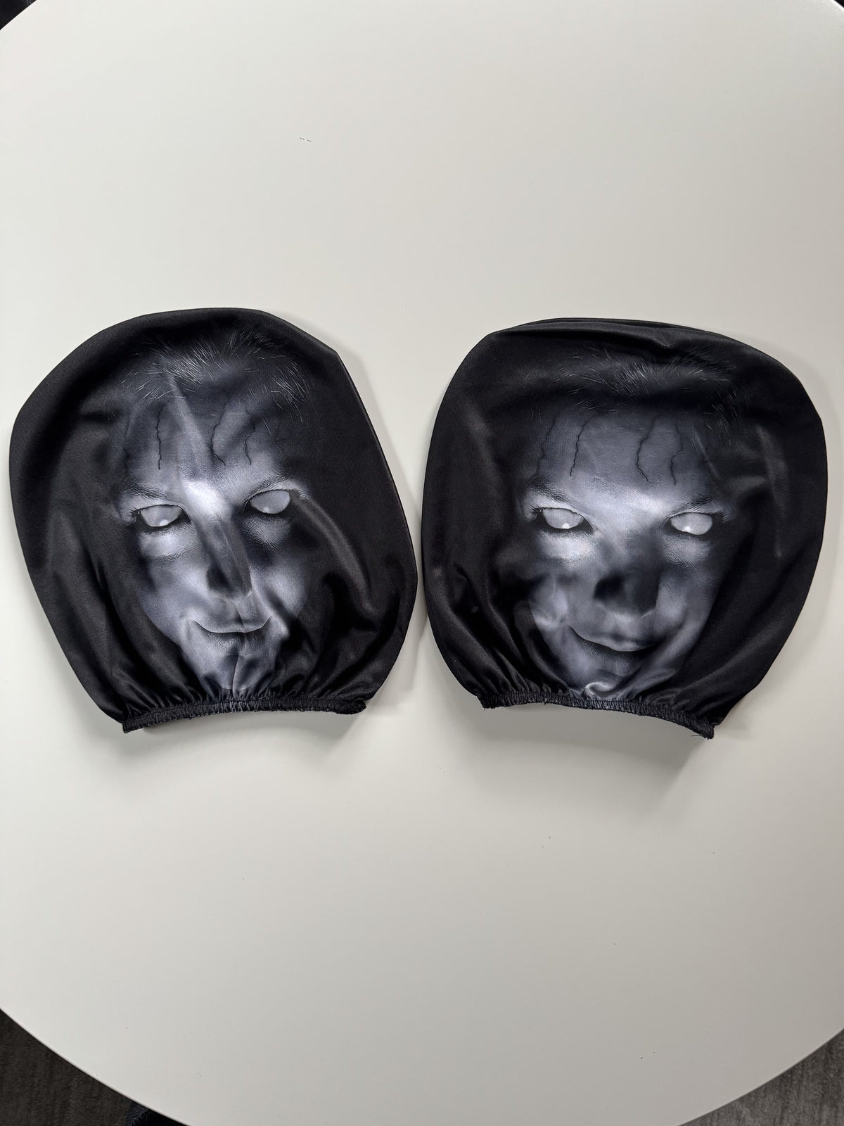 PhantomSeat ghost headrest cover fitted on a car headrest in daylight